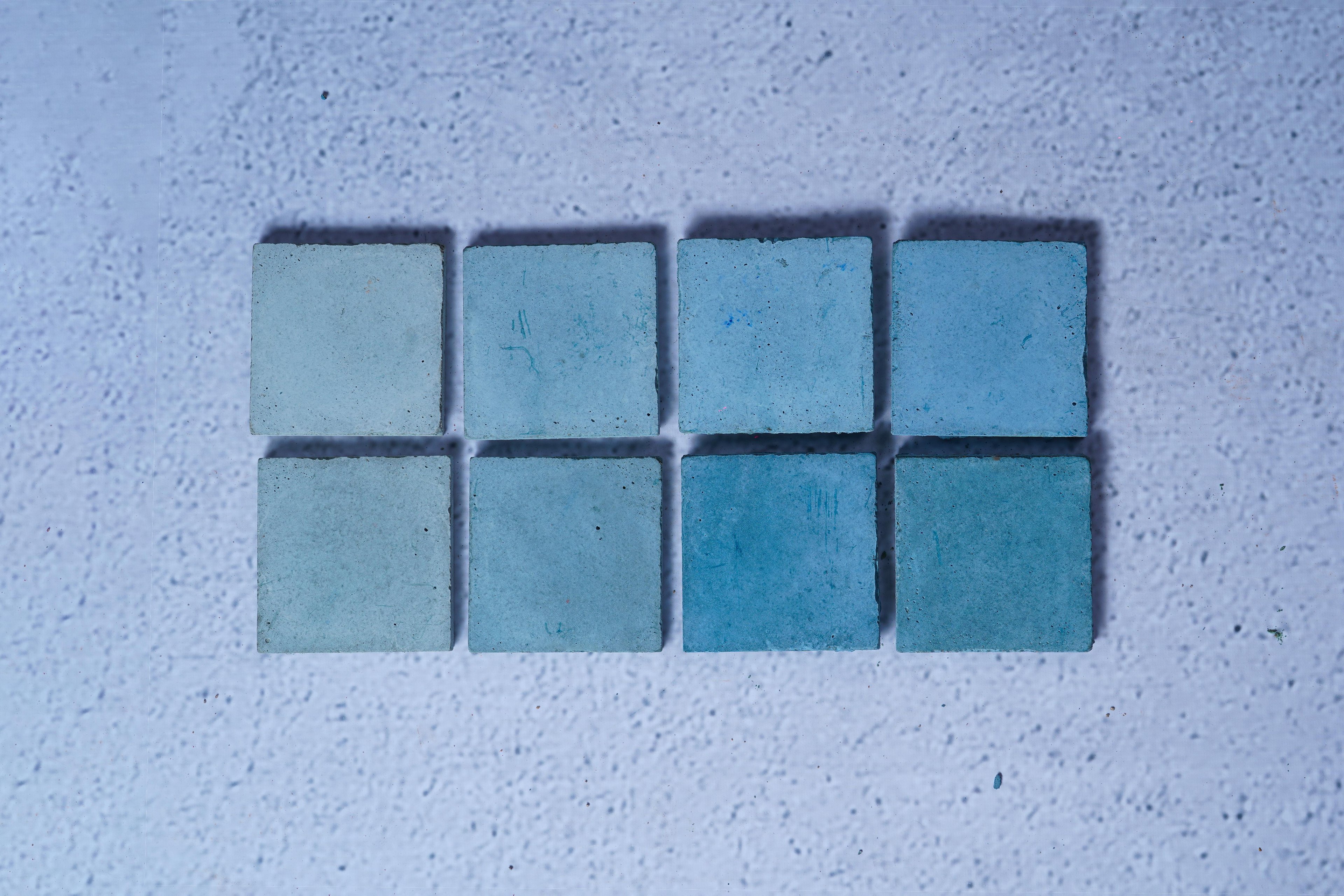 2 rows of 4 bricks in the style Steel Blue, with the first row showing the raw finish and the second showing the enhanced.