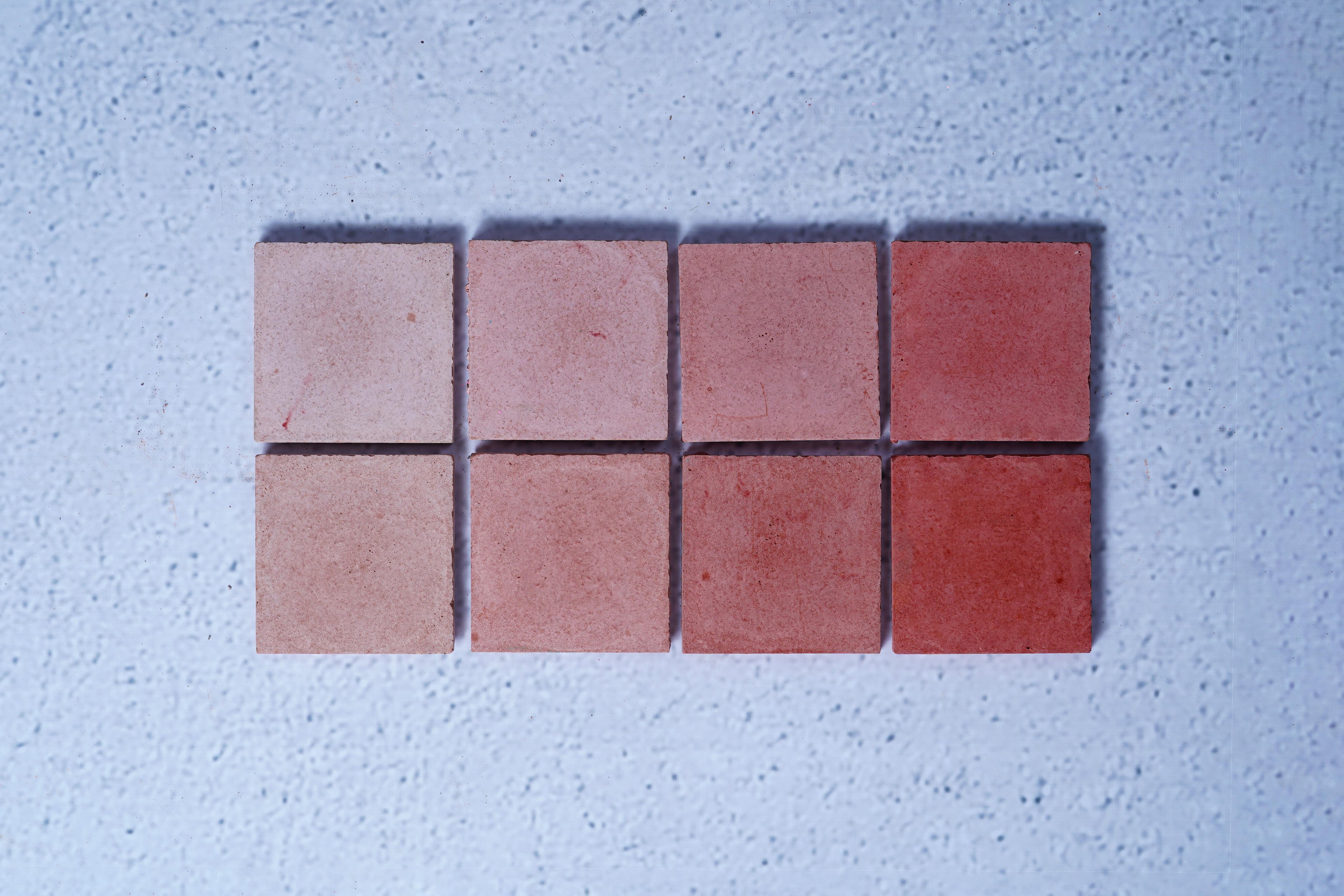 2 rows of 4 bricks in the style Brick Red, with the first row showing the raw finish and the second showing the enhanced.