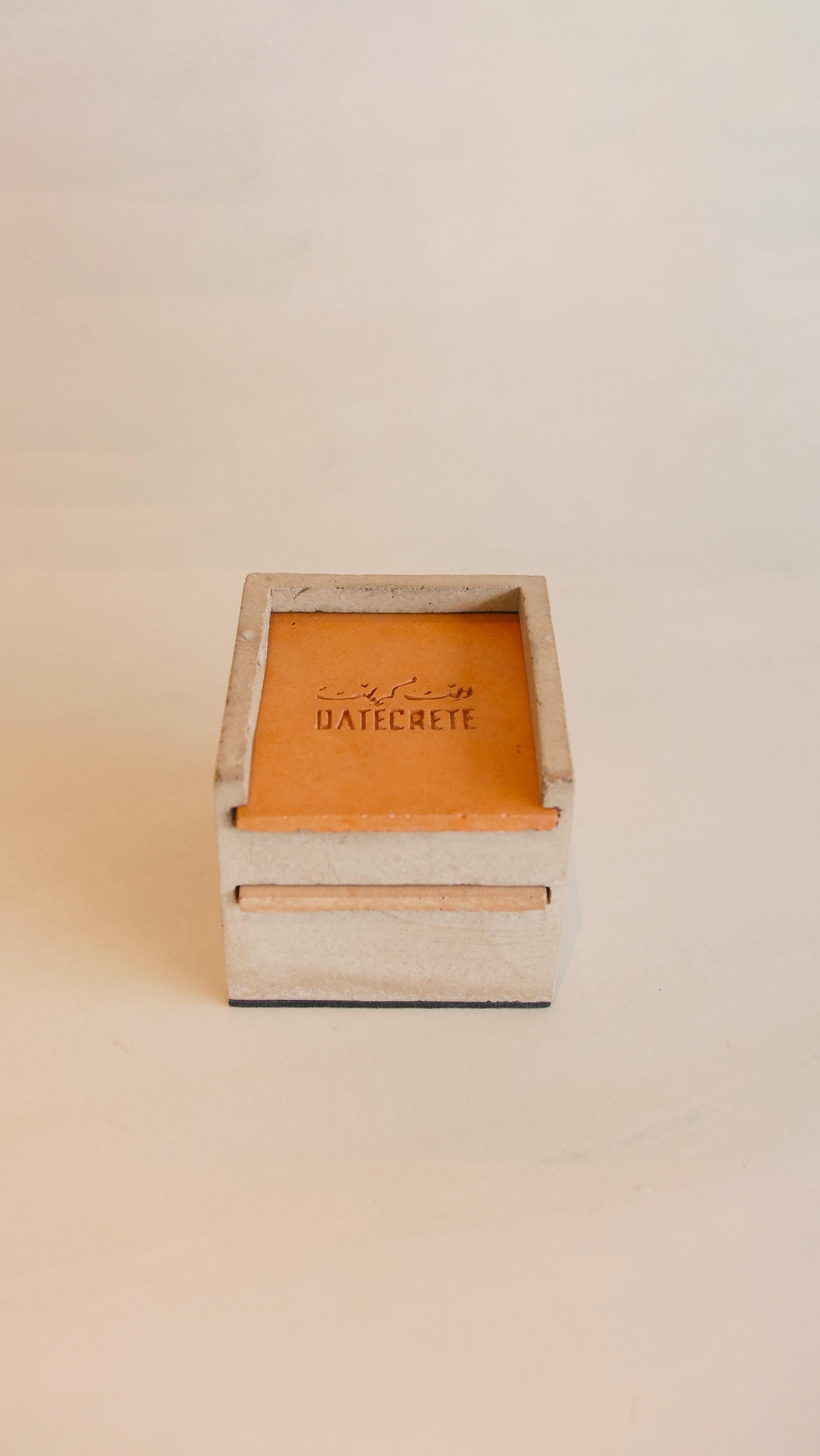 High angle portrait shot of the Datecrete sample box.